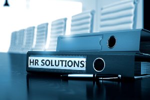 HR Solutions Ring Binder on a Wooden Desktop