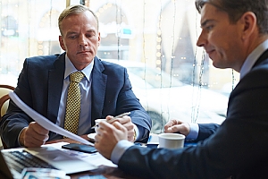 Insurance Consultant showing options to a client