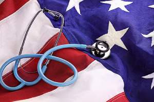 Stethoscope placed over American flag, a Concept image of ACA Compliance Assistance from an HR solutions provider
