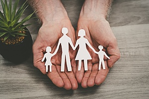 a cutout of a family representing life insurance