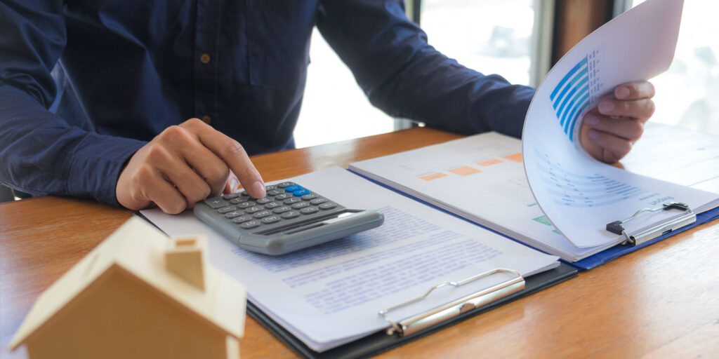 A retirement plan consultant using a calculator