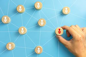 Boss using wood pieces in performance appraisal 