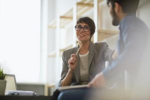 Employee in glasses with pen