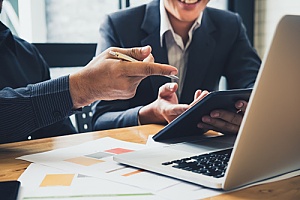 two business employees discussing their retirement plans